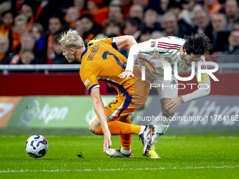 Netherlands defender Jan-Paul van Hecke and Hungary midfielder Dominik Szoboszlai participate in the match between the Netherlands and Hunga...