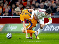 Netherlands defender Jan-Paul van Hecke and Hungary midfielder Dominik Szoboszlai participate in the match between the Netherlands and Hunga...