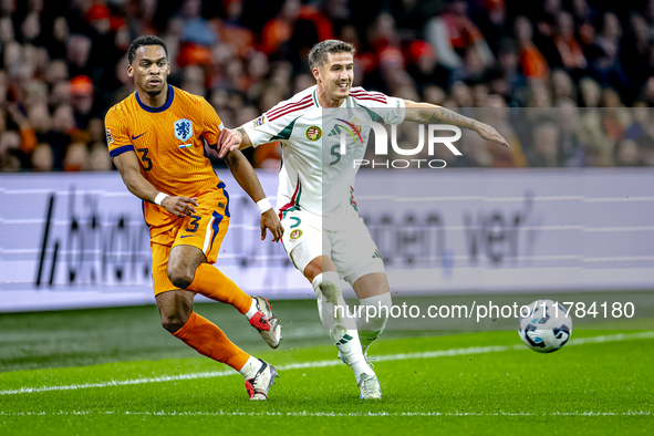 Netherlands defender Jurrien Timber and Hungary midfielder Tamas Nikitscher play during the match between the Netherlands and Hungary at the...