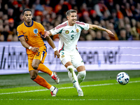 Netherlands defender Jurrien Timber and Hungary midfielder Tamas Nikitscher play during the match between the Netherlands and Hungary at the...