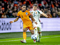 Netherlands defender Jurrien Timber and Hungary midfielder Tamas Nikitscher play during the match between the Netherlands and Hungary at the...