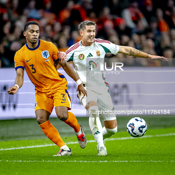 Netherlands defender Jurrien Timber and Hungary midfielder Tamas Nikitscher play during the match between the Netherlands and Hungary at the...