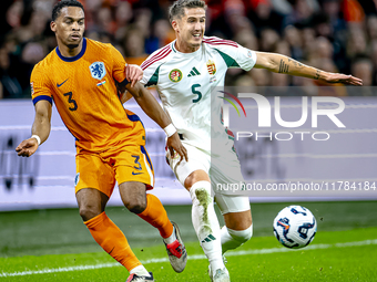 Netherlands defender Jurrien Timber and Hungary midfielder Tamas Nikitscher play during the match between the Netherlands and Hungary at the...