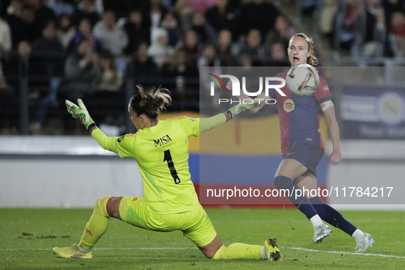 Ewa Pajor of FC Barcelona and Misa of Real Madrid are in action during the LIGA F match between Real Madrid and FC Barcelona at Alfredo Di S...