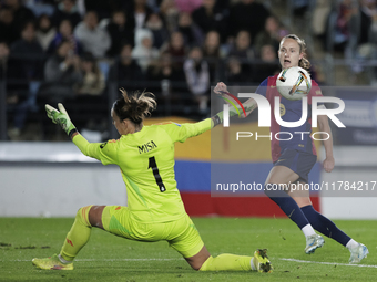 Ewa Pajor of FC Barcelona and Misa of Real Madrid are in action during the LIGA F match between Real Madrid and FC Barcelona at Alfredo Di S...