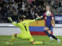 Ewa Pajor of FC Barcelona and Misa of Real Madrid are in action during the LIGA F match between Real Madrid and FC Barcelona at Alfredo Di S...