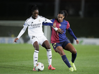 Naomie Feller of Real Madrid and Esmee Brugts of FC Barcelona fight for the ball during the LIGA F match between Real Madrid and FC Barcelon...