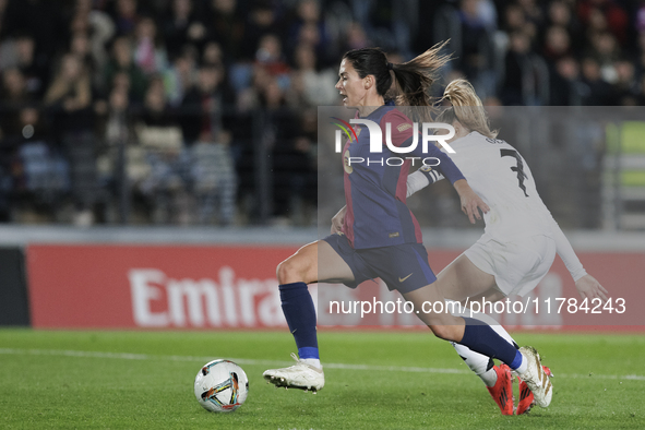 Aitana Bonmati of FC Barcelona and Olga Carmona of Real Madrid are in action during the LIGA F match between Real Madrid and FC Barcelona at...