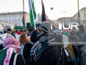 More than 1,000 people march through the center of Turin, Italy, on November 16, 2024, calling for a boycott of Israel and a ceasefire in th...