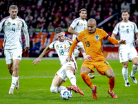 Hungary midfielder Zsolt Nagy and Netherlands forward Donyell Malen participate in the match between the Netherlands and Hungary at the Joha...