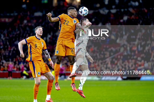 Netherlands defender Denzel Dumfries and Hungary midfielder Zsolt Nagy participate in the match between the Netherlands and Hungary at the J...