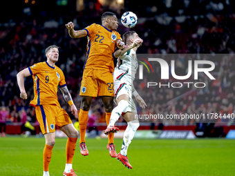 Netherlands defender Denzel Dumfries and Hungary midfielder Zsolt Nagy participate in the match between the Netherlands and Hungary at the J...