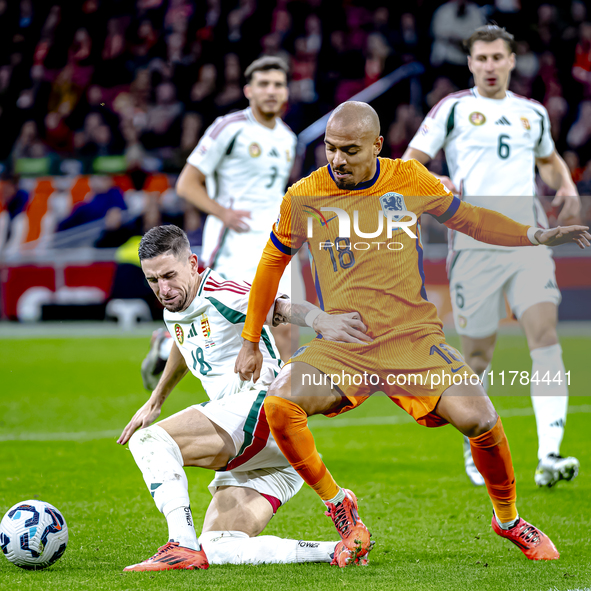 Hungary midfielder Zsolt Nagy and Netherlands forward Donyell Malen participate in the match between the Netherlands and Hungary at the Joha...