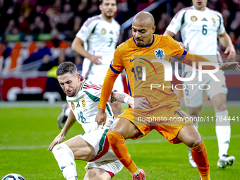 Hungary midfielder Zsolt Nagy and Netherlands forward Donyell Malen participate in the match between the Netherlands and Hungary at the Joha...