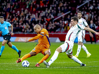 Netherlands forward Donyell Malen and Hungary defender Willi Orban play during the match between the Netherlands and Hungary at the Johan Cr...