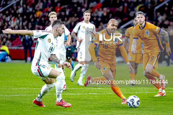 Hungary midfielder Zsolt Nagy and Netherlands forward Donyell Malen participate in the match between the Netherlands and Hungary at the Joha...