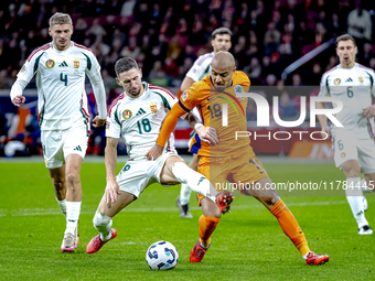 Hungary midfielder Zsolt Nagy and Netherlands forward Donyell Malen participate in the match between the Netherlands and Hungary at the Joha...