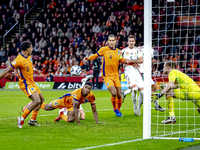 Netherlands forward Cody Gakpo, Netherlands defender Virgil van Dijk, and Netherlands defender Jurrien Timber are present during the match b...