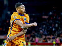 Netherlands defender Denzel Dumfries scores the 3-0 goal and celebrates during the match between the Netherlands and Hungary at the Johan Cr...