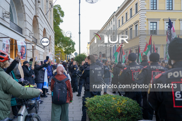 A demonstration in Munich, Germany, on November 16, 2024, includes pro-Palestinian demonstrators and pro-Israeli counter-demonstrators with...