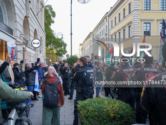 A demonstration in Munich, Germany, on November 16, 2024, includes pro-Palestinian demonstrators and pro-Israeli counter-demonstrators with...