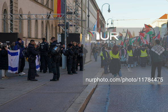 A demonstration in Munich, Germany, on November 16, 2024, includes pro-Palestinian demonstrators and pro-Israeli counter-demonstrators with...