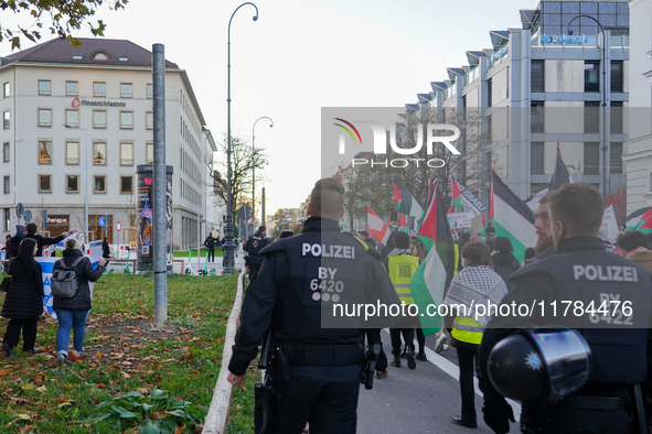 A demonstration in Munich, Germany, on November 16, 2024, includes pro-Palestinian demonstrators and pro-Israeli counter-demonstrators with...