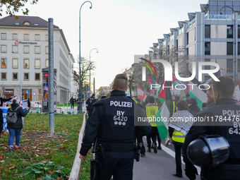 A demonstration in Munich, Germany, on November 16, 2024, includes pro-Palestinian demonstrators and pro-Israeli counter-demonstrators with...