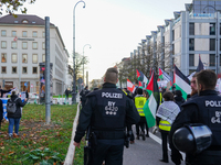 A demonstration in Munich, Germany, on November 16, 2024, includes pro-Palestinian demonstrators and pro-Israeli counter-demonstrators with...