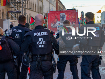 A demonstration in Munich, Germany, on November 16, 2024, includes pro-Palestinian demonstrators and pro-Israeli counter-demonstrators with...