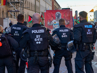 A demonstration in Munich, Germany, on November 16, 2024, includes pro-Palestinian demonstrators and pro-Israeli counter-demonstrators with...