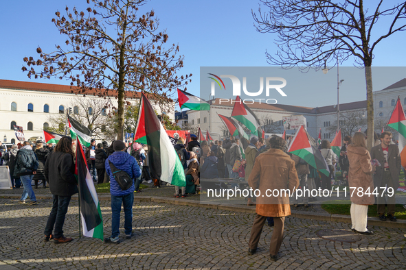 A demonstration in Munich, Germany, on November 16, 2024, includes pro-Palestinian demonstrators and pro-Israeli counter-demonstrators with...