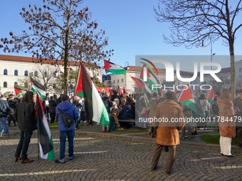 A demonstration in Munich, Germany, on November 16, 2024, includes pro-Palestinian demonstrators and pro-Israeli counter-demonstrators with...