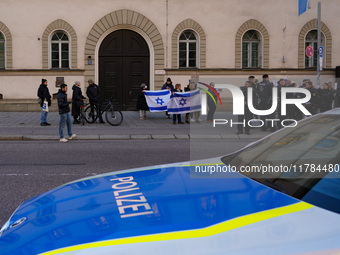 A demonstration in Munich, Germany, on November 16, 2024, includes pro-Palestinian demonstrators and pro-Israeli counter-demonstrators with...