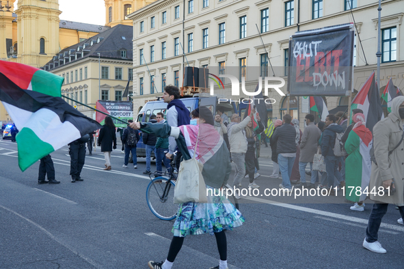 A demonstration in Munich, Germany, on November 16, 2024, includes pro-Palestinian demonstrators and pro-Israeli counter-demonstrators with...