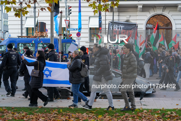 A demonstration in Munich, Germany, on November 16, 2024, includes pro-Palestinian demonstrators and pro-Israeli counter-demonstrators with...