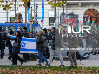 A demonstration in Munich, Germany, on November 16, 2024, includes pro-Palestinian demonstrators and pro-Israeli counter-demonstrators with...