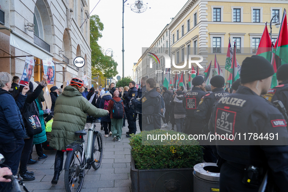 A demonstration in Munich, Germany, on November 16, 2024, includes pro-Palestinian demonstrators and pro-Israeli counter-demonstrators with...