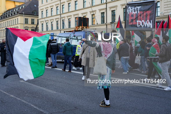 A demonstration in Munich, Germany, on November 16, 2024, includes pro-Palestinian demonstrators and pro-Israeli counter-demonstrators with...