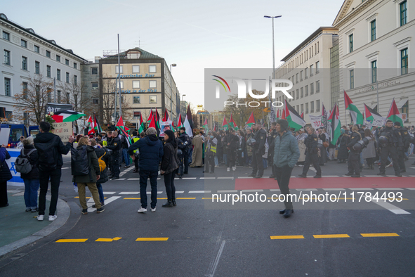 A demonstration in Munich, Germany, on November 16, 2024, includes pro-Palestinian demonstrators and pro-Israeli counter-demonstrators with...