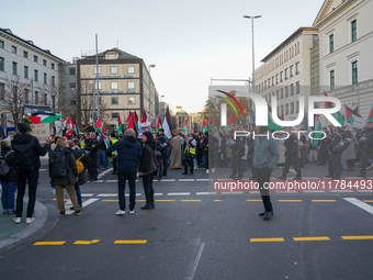 A demonstration in Munich, Germany, on November 16, 2024, includes pro-Palestinian demonstrators and pro-Israeli counter-demonstrators with...