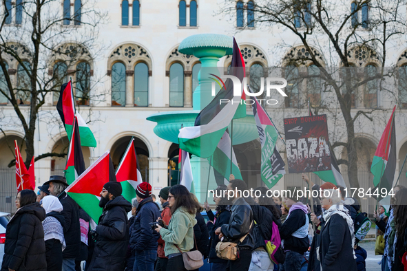 A demonstration in Munich, Germany, on November 16, 2024, includes pro-Palestinian demonstrators and pro-Israeli counter-demonstrators with...