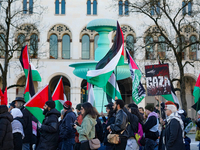 A demonstration in Munich, Germany, on November 16, 2024, includes pro-Palestinian demonstrators and pro-Israeli counter-demonstrators with...