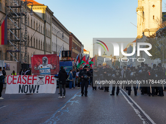 A demonstration in Munich, Germany, on November 16, 2024, includes pro-Palestinian demonstrators and pro-Israeli counter-demonstrators with...