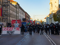 A demonstration in Munich, Germany, on November 16, 2024, includes pro-Palestinian demonstrators and pro-Israeli counter-demonstrators with...