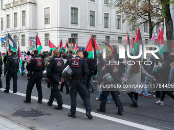 A demonstration in Munich, Germany, on November 16, 2024, includes pro-Palestinian demonstrators and pro-Israeli counter-demonstrators with...