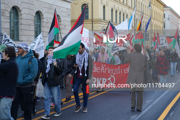 A demonstration in Munich, Germany, on November 16, 2024, includes pro-Palestinian demonstrators and pro-Israeli counter-demonstrators with...