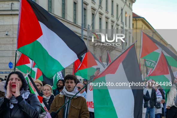 A demonstration in Munich, Germany, on November 16, 2024, includes pro-Palestinian demonstrators and pro-Israeli counter-demonstrators with...