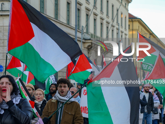 A demonstration in Munich, Germany, on November 16, 2024, includes pro-Palestinian demonstrators and pro-Israeli counter-demonstrators with...