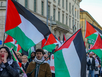 A demonstration in Munich, Germany, on November 16, 2024, includes pro-Palestinian demonstrators and pro-Israeli counter-demonstrators with...